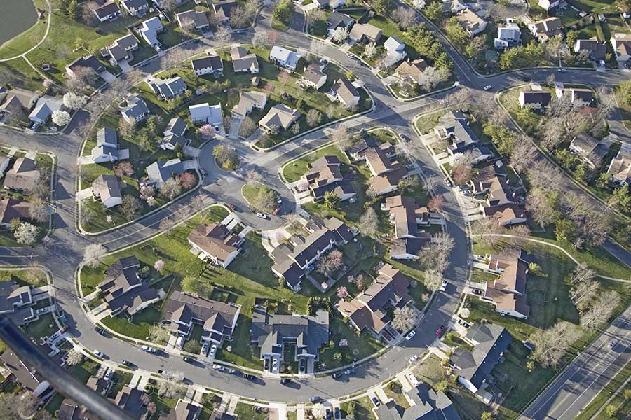 Hermitage, PA - Aerial View of Residential Homes on Curved Roads With Trees on a Sunny Day