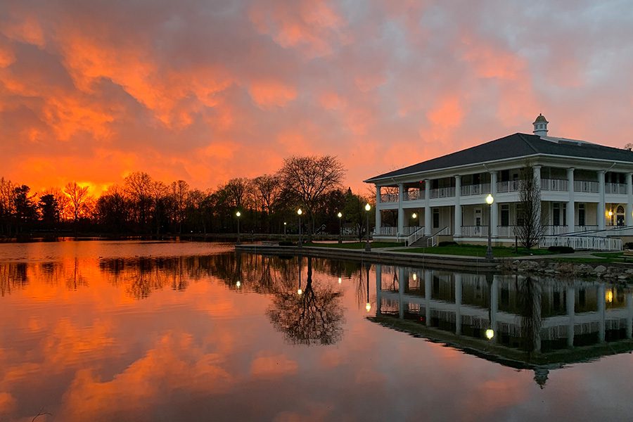 Contact - Large Home by a Lake During Sunset With Reflections in the Water